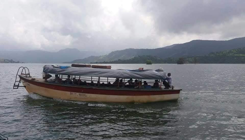 Passenger boat on Kaas Lake with Sahyadri hills